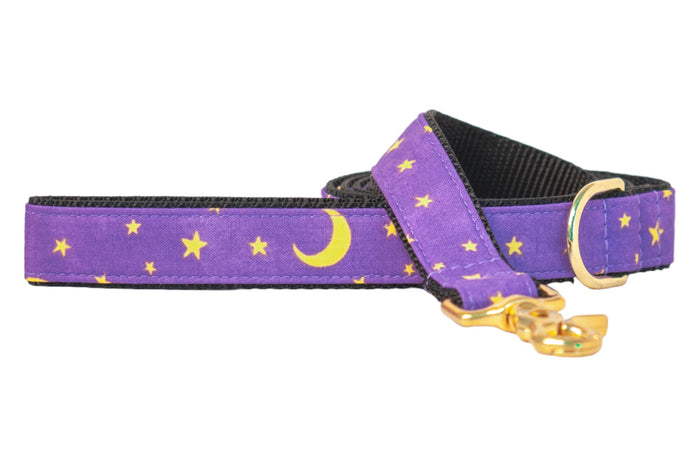 Celestial-themed purple dog leash with stars and crescent moons, backed with nylon webbing and finished with metal hardware. Perfect for Halloween walks, the design adds a magical, spooky-season vibe without being over-the-top.