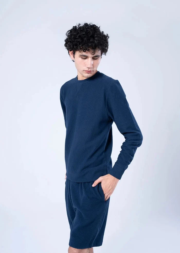Navy crewneck sweatshirt and matching shorts, long sleeves with ribbed cuffs and hem