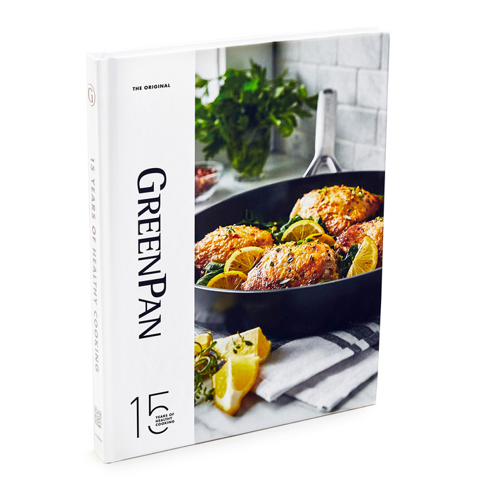 Hardcover cookbook with cover showing baked chicken and lemon slices in a black pan. 85 recipes inside.