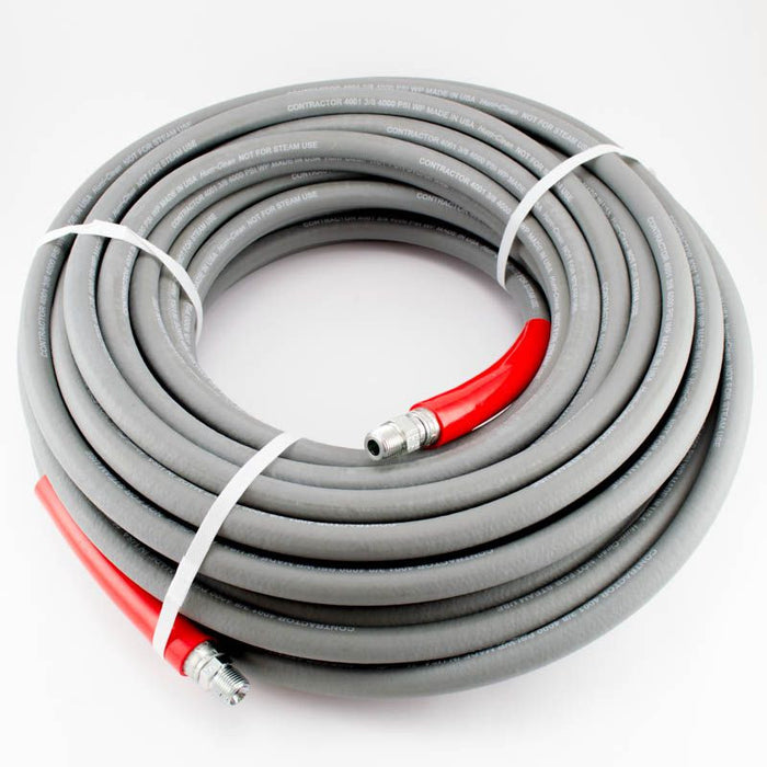 A gray high pressure wash hose with red ends, coiled and tied with a white band.