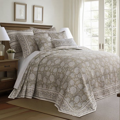 Bedroom with patterned bedding and wooden nightstand