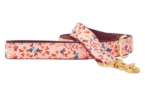 Fashionable dog leash with a blush pink floral-print, nylon underside for strength, and a metal swivel snap hook and D-ring.