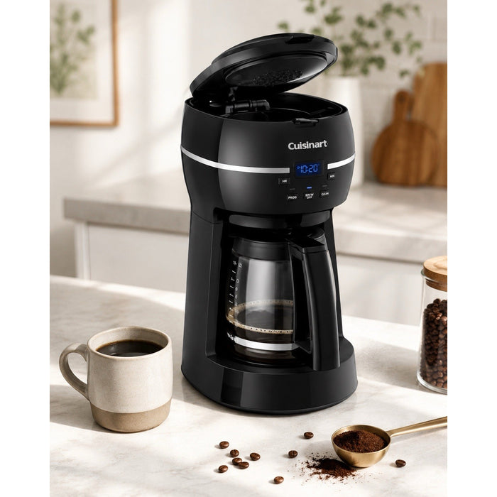 Catalog view of black Cuisinart DCC-1500FR coffee maker brewing into glass carafe with top lid open, cup, beans, and coffee scoop.