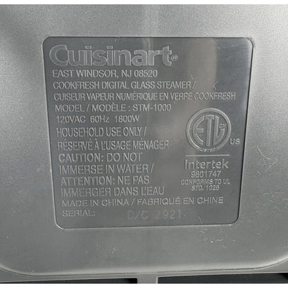 Cuisinart CookFresh steamer underside label showing model STM-1000, 120 VAC, 60 Hz, 1800 W and Made in China.