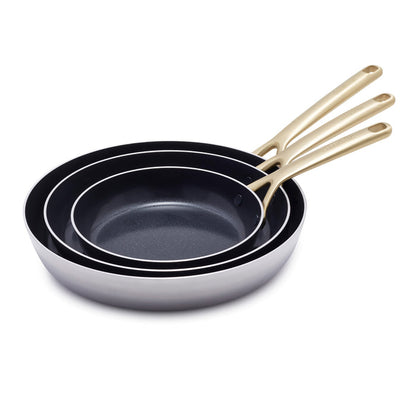 Set of three stainless steel frypans with champagne-colored handles, nested together on a white background.