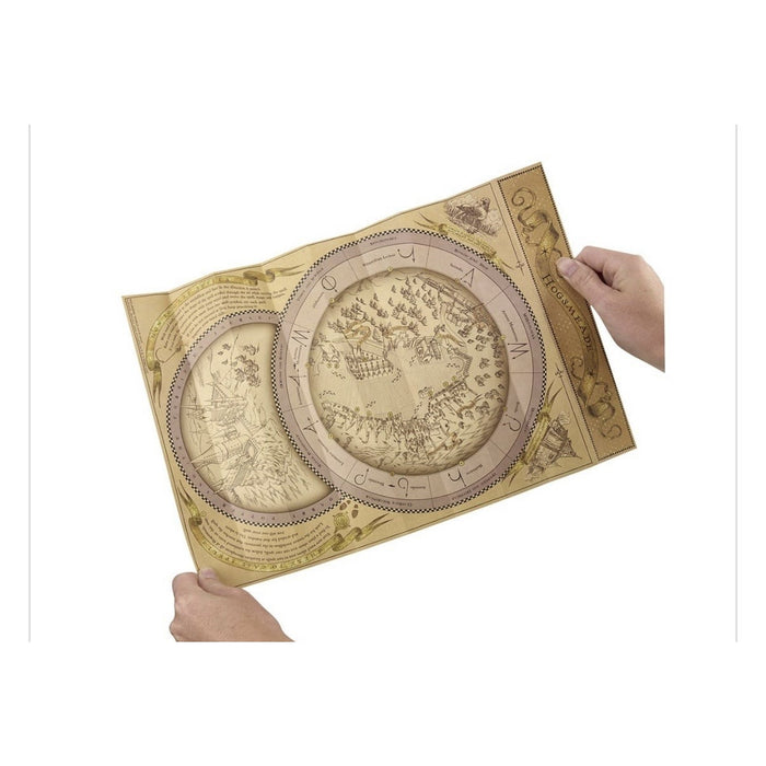 Hands holding an unfolded Hogsmeade spell map with circular illustrations and wand-movement symbols.