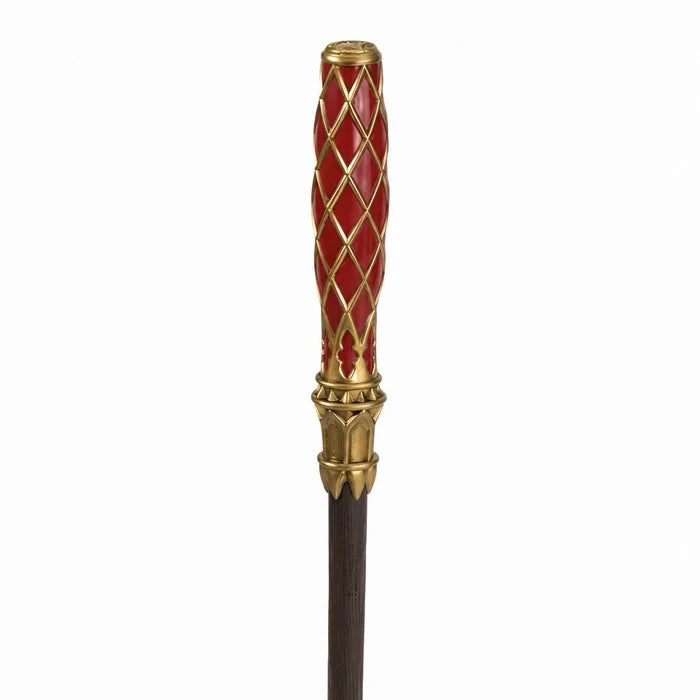 Close-up of the Redwood wand's red handle with gold-colored lattice and decorative collar.