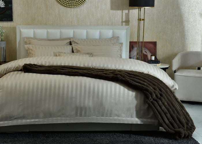 7-piece duvet cover set with light striped duvet and matching pillow shams