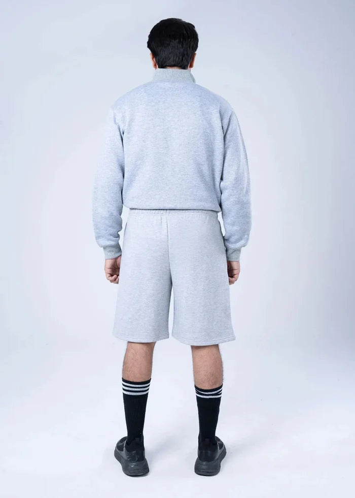 Men's grey fleece sweat shorts with elastic waistband and drawstring tie, knee length