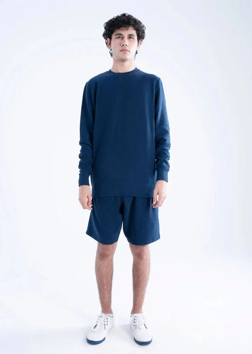 Navy waffle-knit crewneck sweatshirt with matching navy shorts, long sleeves and ribbed cuffs