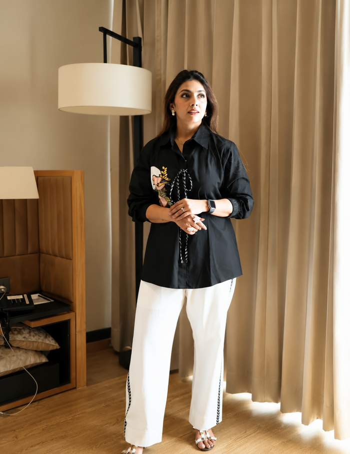 Black Bemberg Silk Co-Ord Set featuring a sculpted floral tie-detail shirt paired with ivory straight-fit pants for an elegant and contemporary look.