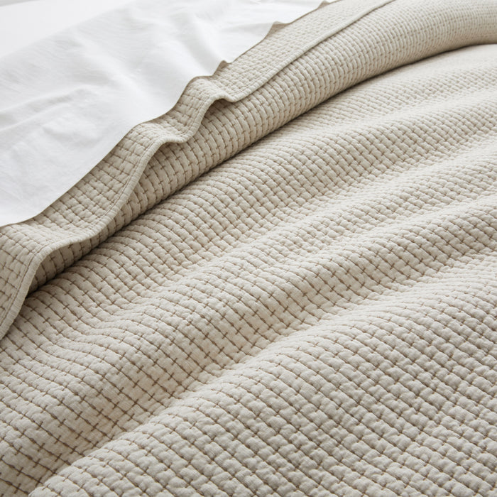 Close-up of the Pick-Stitch Artisan Quilt Set showcasing its textured slub cotton surface and pick-stitch detailing.