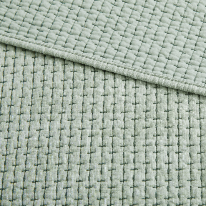 Pick-Stitch Artisan Quilted Throw featuring a textured, quilted cotton slub surface with soft pick-stitch detailing.