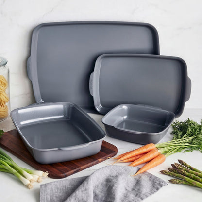 Gray ceramic nonstick 4-piece ovenware set on a table with assorted vegetables.