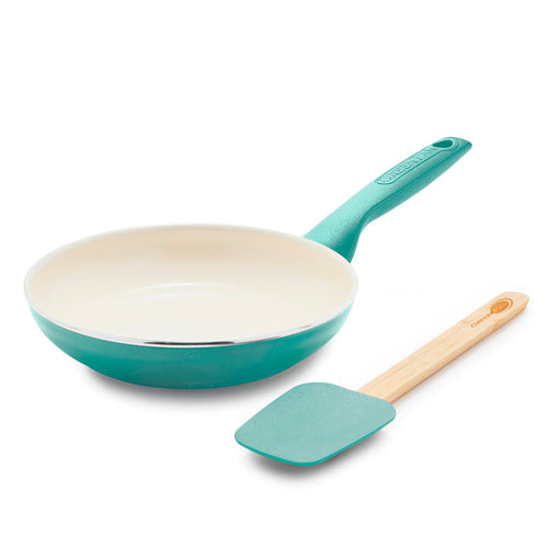 The Rio Ceramic Nonstick 8" Frypan with Spatula in turquoise, featuring a cream interior pan and PFAS-free silicone spatula with a wooden handle, are displayed side by side on a white background.