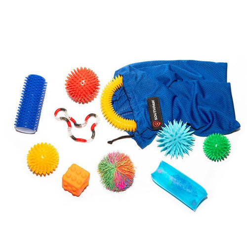 Southpaw Sensory Tactile Set, a tactile sensory kit and sensory kit for touch, with spiky balls, a textured roller, a twist fidget and other tactile sensory toys beside a blue Southpaw mesh bag