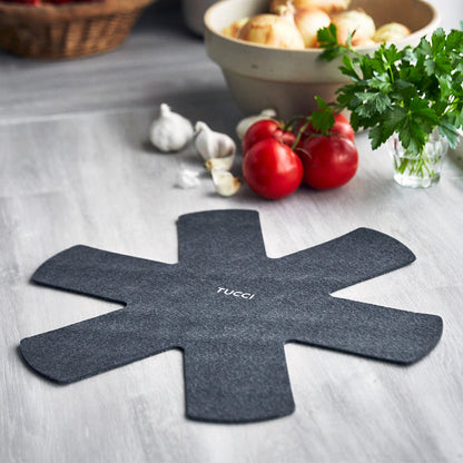 Milano Black ceramic nonstick pan, 6.5-quart size, next to tomatoes, parsley, and garlic.