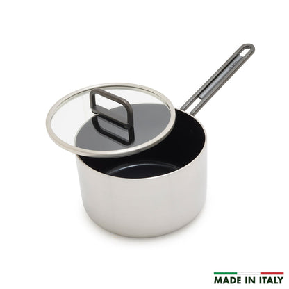 Stainless steel saucepan with ceramic nonstick interior, glass lid, long handle, and Made in Italy label. 2 quart size.