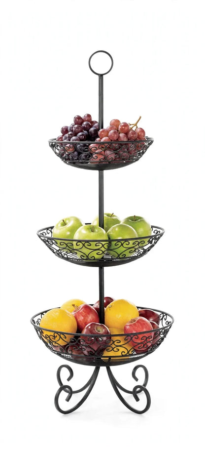 Black three-tier TableCraft display basket with grapes, green apples, red apples and lemons against a white background.