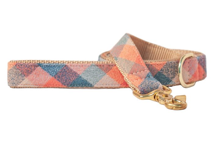 Stylish dog leash made from flannel fabric in a pastel plaid pattern, finished with sturdy hardware.