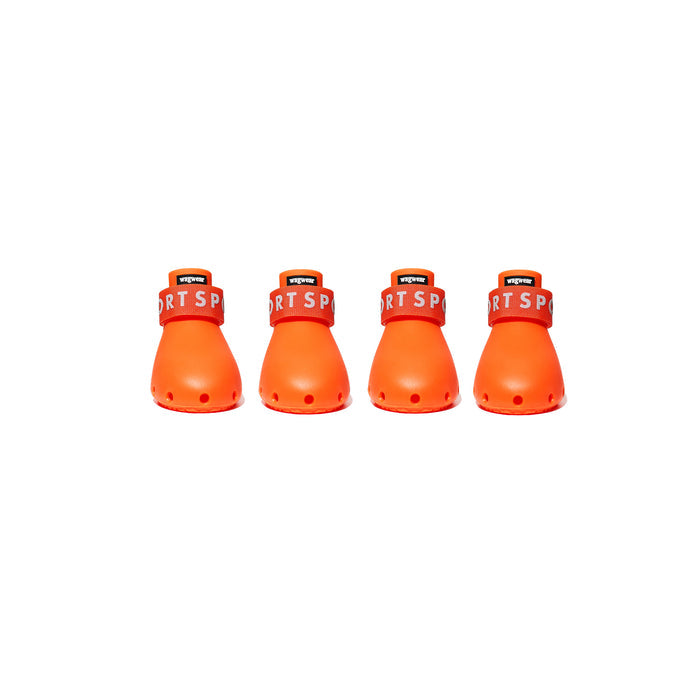 Four orange dog boots arranged in a row on a white background