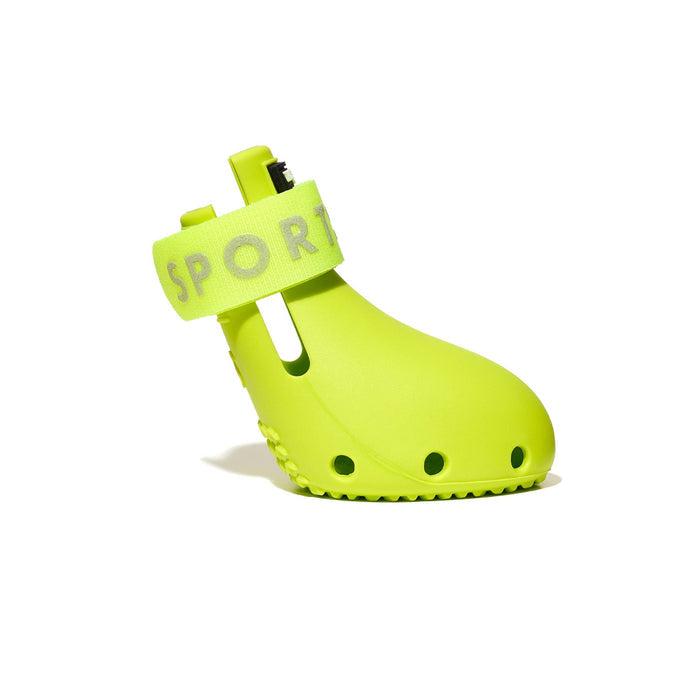 Bright green dog shoe with 'SPORT' label on a white background