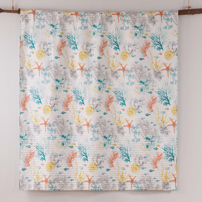 Colorful quilt with marine pattern on a white background