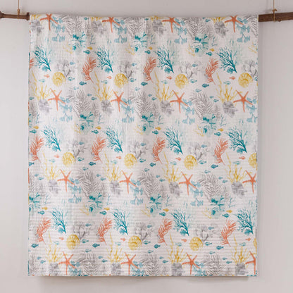 Colorful quilt with marine pattern on a white background