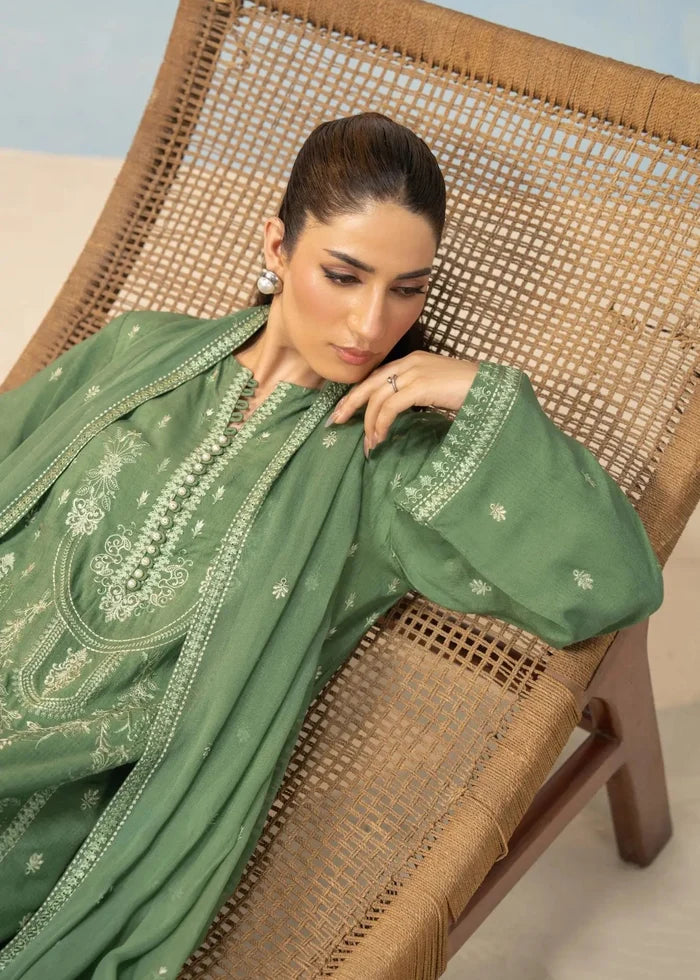 Green suit with flowing dupatta and detailed neckline embroidery