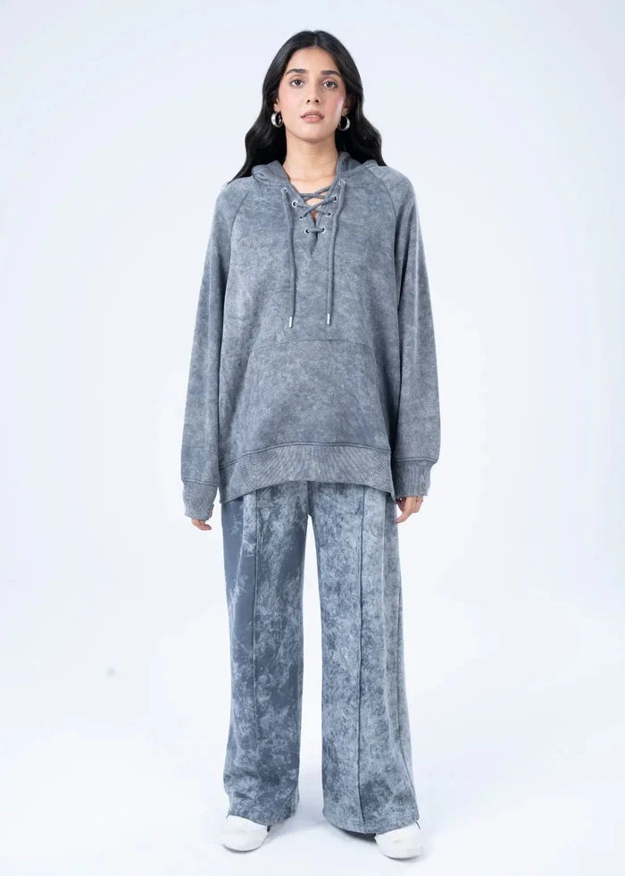 Women's charcoal terry pullover hoodie with drawstring, front view with wide-leg pants