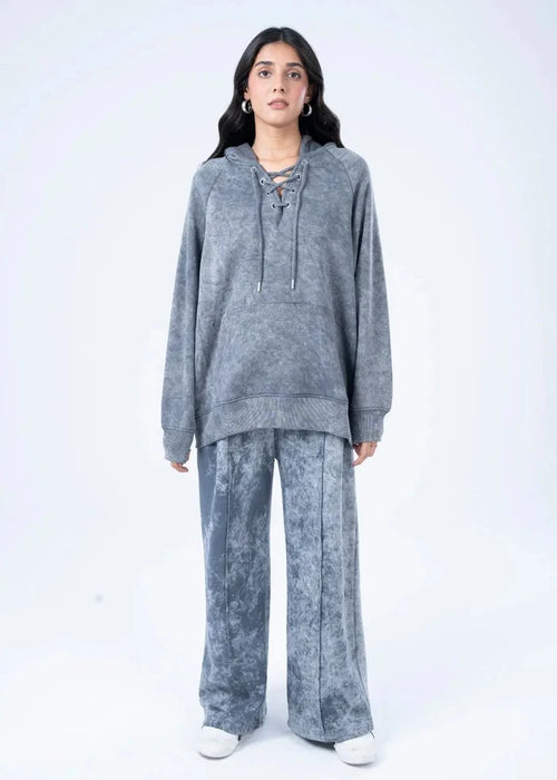Women's charcoal terry pullover hoodie with drawstring, front view with wide-leg pants