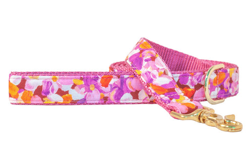 A vibrant floral dog leash bursting with pinks and purple petals, finished with luxe hardware — perfect for pups who love to strut in color.